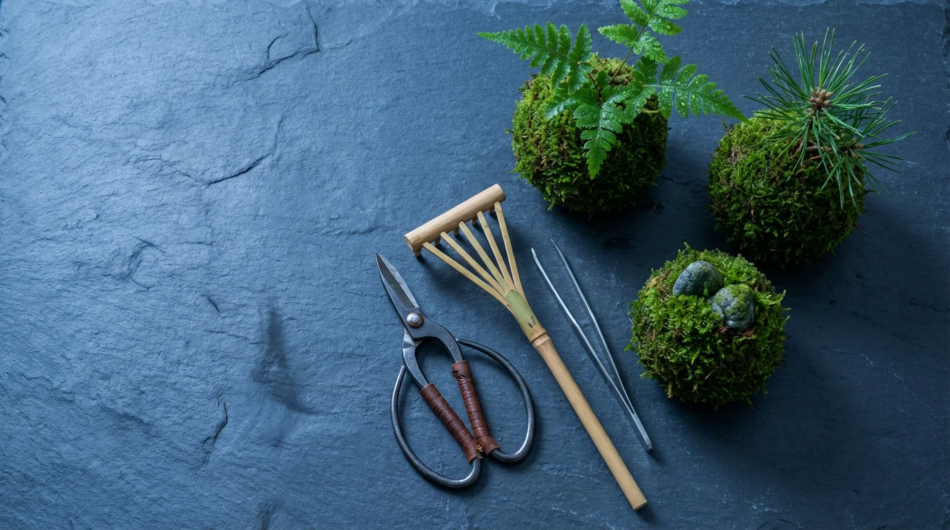 Flat lay of Japanese kokedama moss balls and traditional gardening tools at dusk.